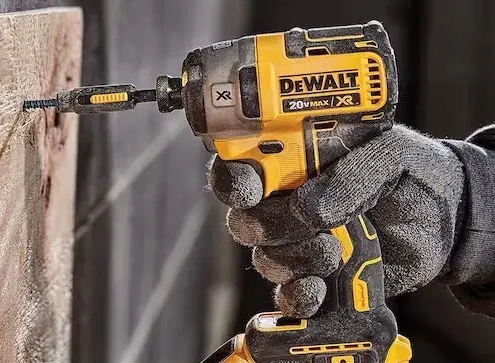 A tradesman using one of the best DeWalt impact drivers