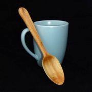 A wooden spoon with a cup